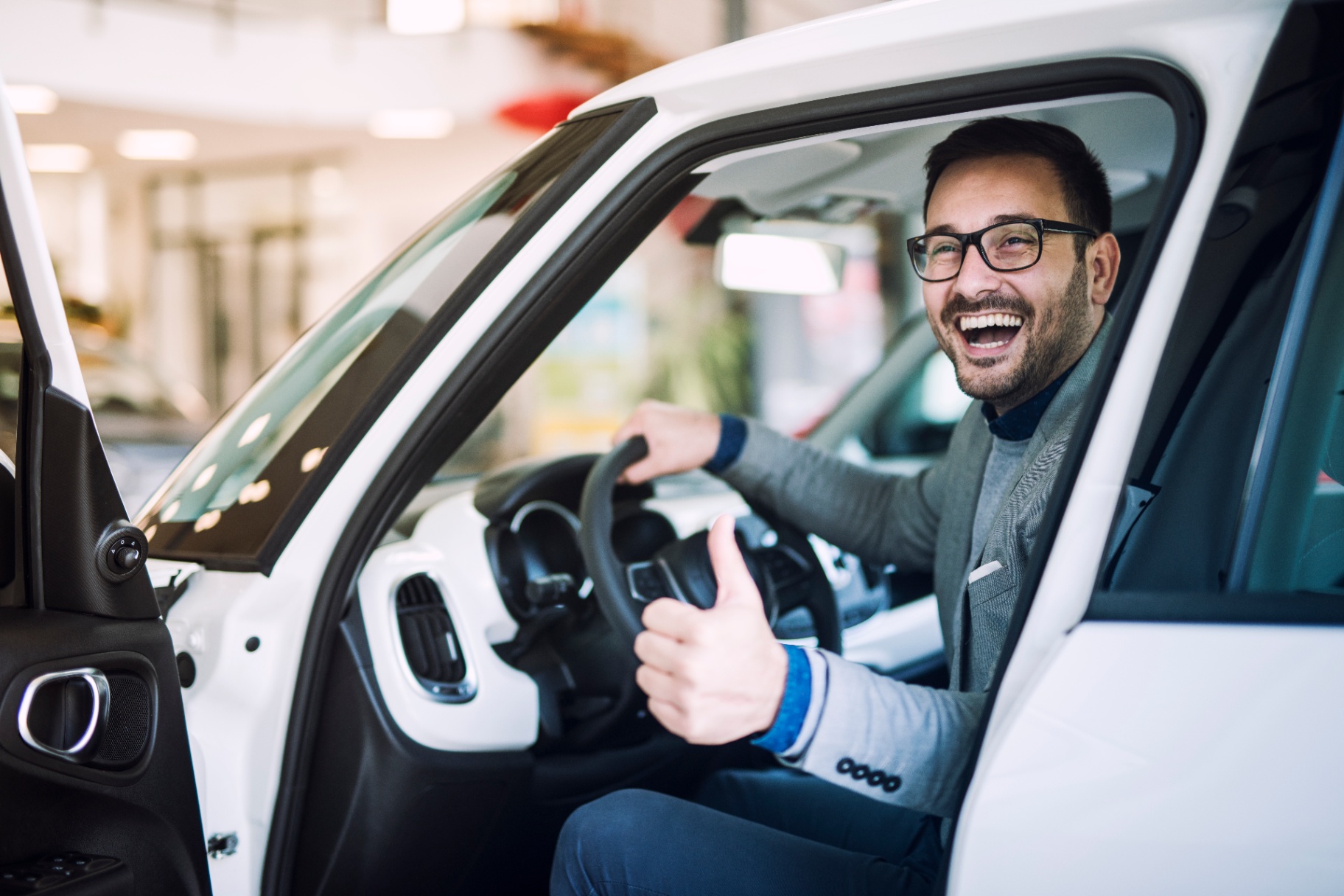 https://hillzcdn.ca/motorsquad/09152159582024932-happy-satisfied-customer-just-bought-brand-new-car-vehicle-dealership.jpg